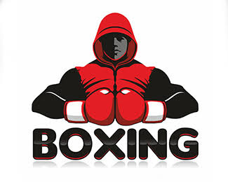 A boxer celebrating victory with arms raised in a brightly lit boxing ring